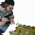 Reese Hussey, biology student participating in the student work on Gooseberry Farm performing tests with hydrogen peroxide on algae that is taking over a pond.