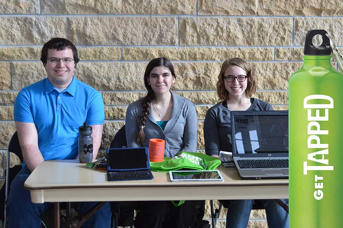 Matt Lindberg, senior sustainable renewable energy systems major, Valeries McGoldrick, freshman soil and crop science major and Andrea Wenzel, senior animal science major work at getting pledges at the Markee Pioneer Student Center. Green Campus Project promotes reusable water bottles.