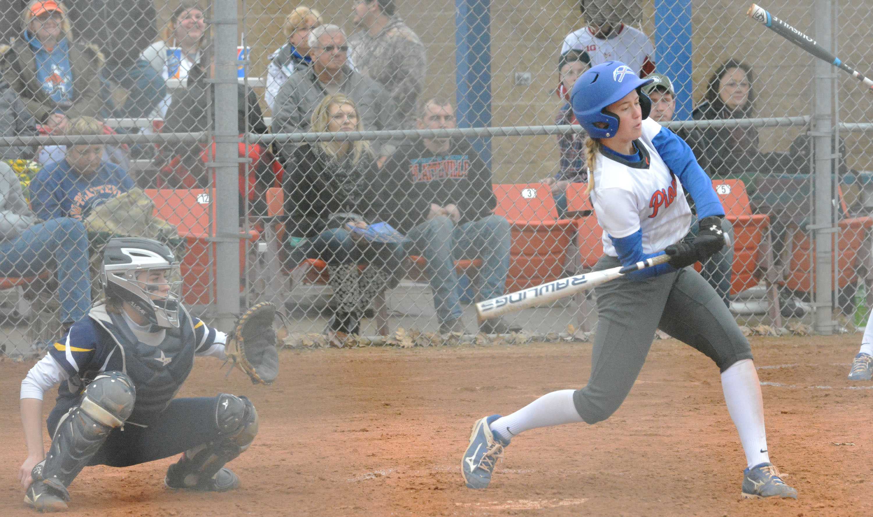 UW-Platteville softball player takes a swing against Beloit College while another teammate prepares behind her.