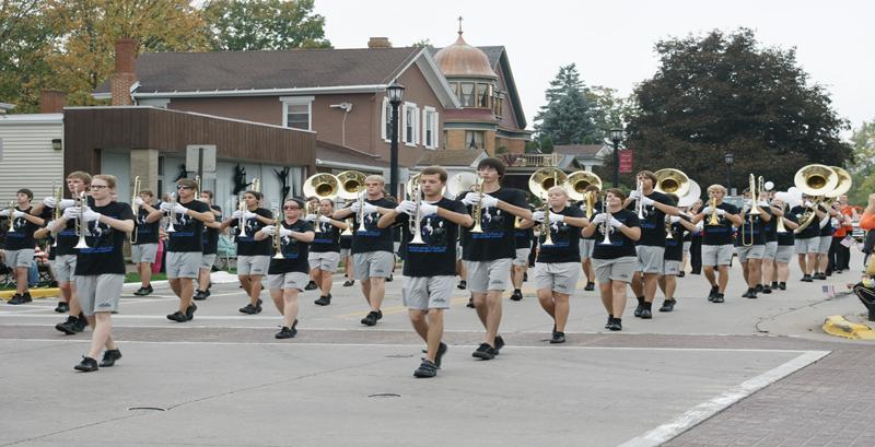 The Pioneer marching band performs at this years Homecoming Parade. The band purchased new uniforms due to increases in number of members.