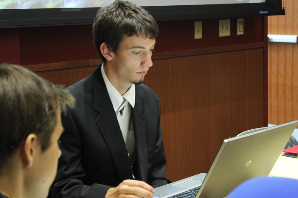 Ryan Schauff, secretary of the Segregated University Fee Allocation Commission, records the minutes during meeting Tuesday night, SUFACs budget process has changed since last year.