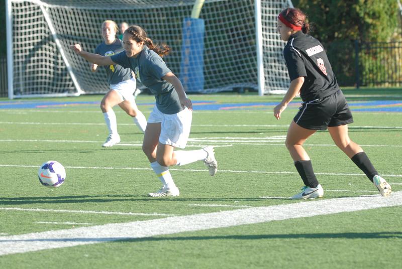 Sophmore Jessica Butler steals a pass against University of Wisconsin-River Falls Oct. 12. The Pioneers took the match to double overtime and tied the Falcons 0-0. The match was played in support of the Never Give Up Suicide Awareness program.