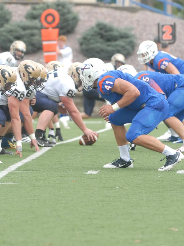 Junior linebacker Andrew Belken (41) awaits the snap on Oct. 5 against University of Wisconsin-Eau Claire, Belken  recorded two sacks in the game.