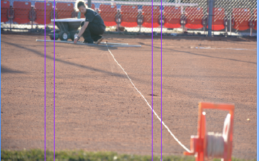 Head coach Lee Negrelli straightens the first base line in preparation for the team’s first home contest against Beloit College on April 1 at the Pioneer Softball Complex.