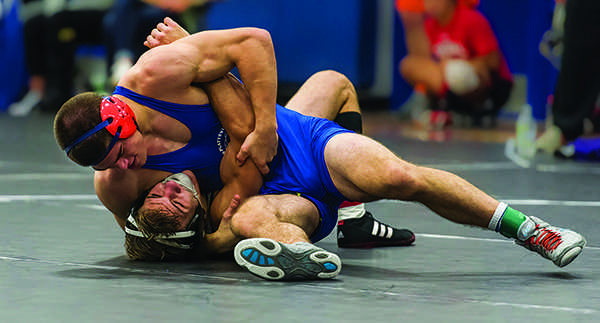 Sophomore Michael Belanger grapples an opponent at the Super 8 Invitational held at UW-Platteville on Nov. 7. The meet was the first of the year for the Pioneers. 