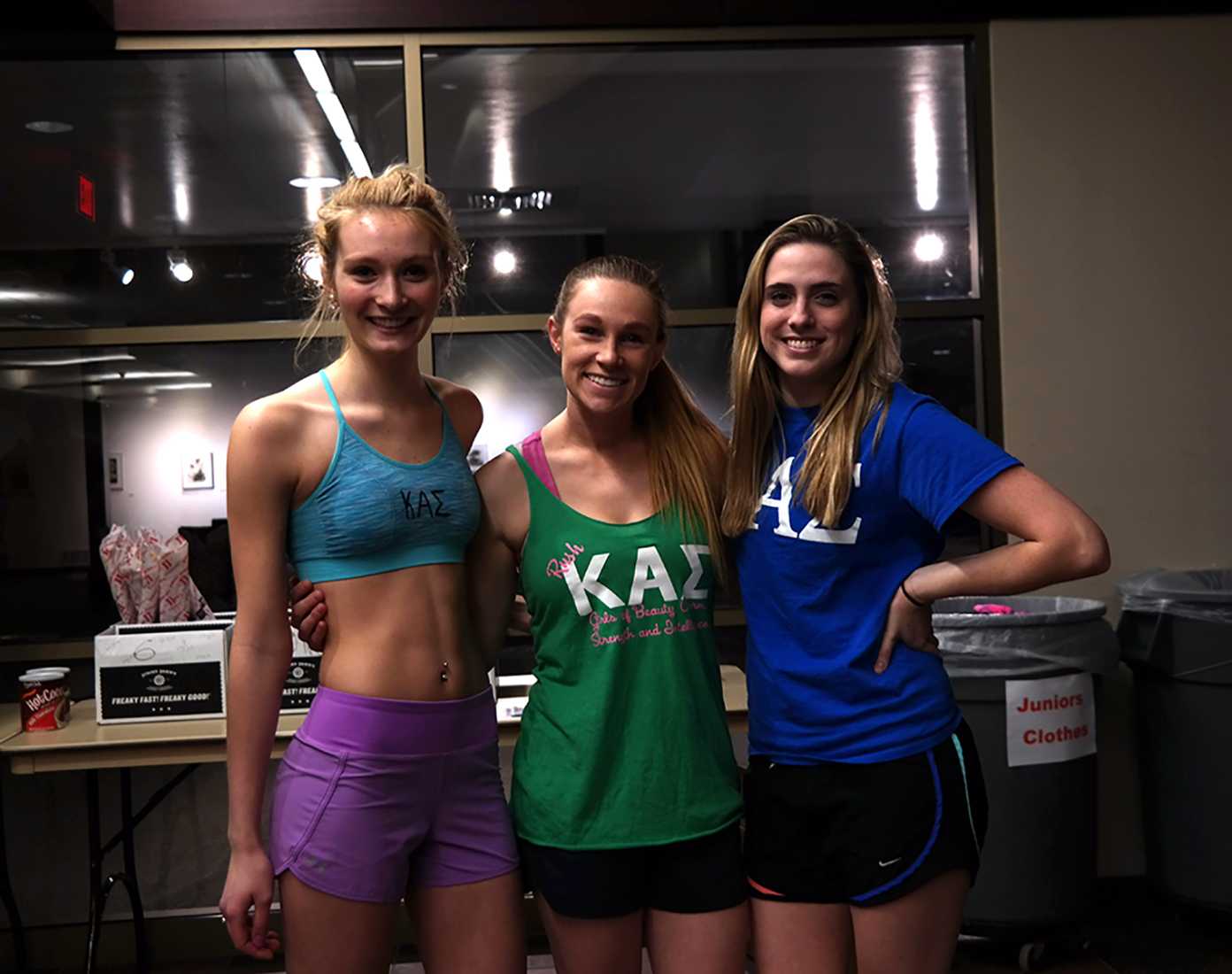 Mackenzie Smid, Anne Gundrum, and Cassie Walsh represent KAE at Nearly Naked Run. 