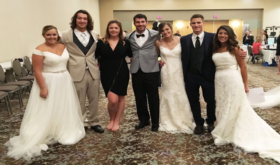 Platteville men and women show off a variety of designer tuxedos and wedding dresses in Zazou’s Bridal show. 