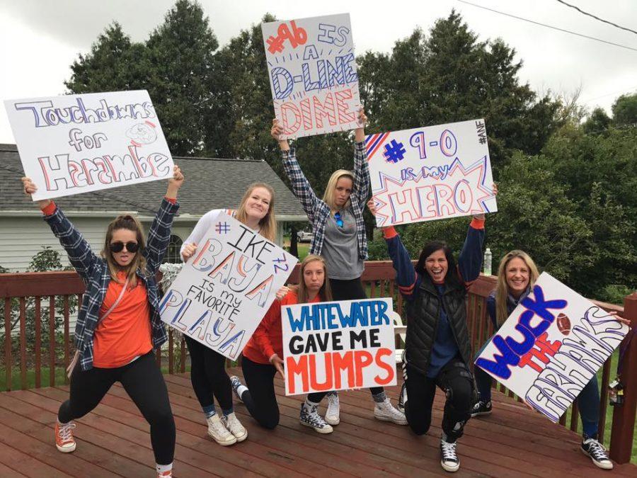 Pioneer women created signs to showcase at the UW-Platteville versus UW-Whitewater football game on Oct. 1.  Students were to wear orange attire to support the undefeated Pioneers.