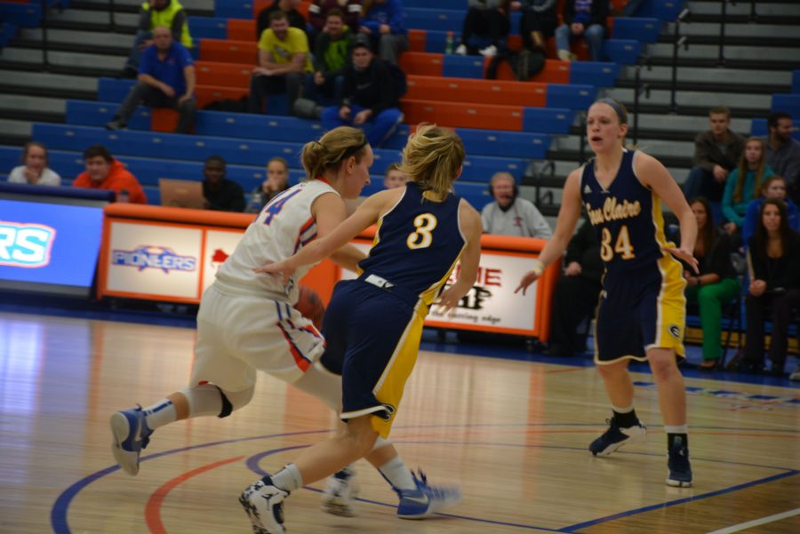 Senior industrial engineering and business administration major Morgan Hartman takes on the Eau Claire defense on her home court during the Jan. 25 game.