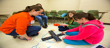 Senior civil engineering major Katie Rash explains how highway crossings work to future engineers.