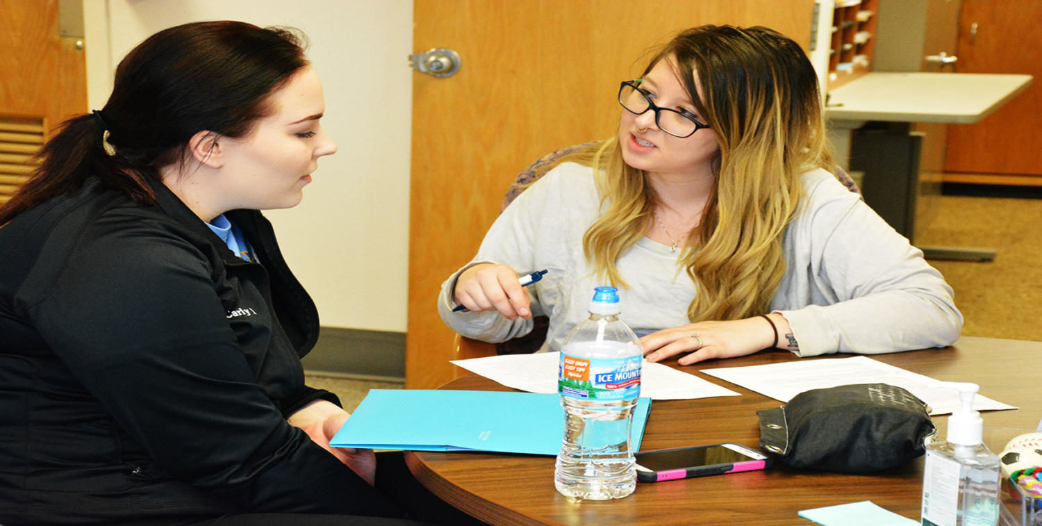 Senior professional writing major BriAnna Bruce assists junior biology major Carly Muller with the revision process. If you need assistance contact the Writing Center.