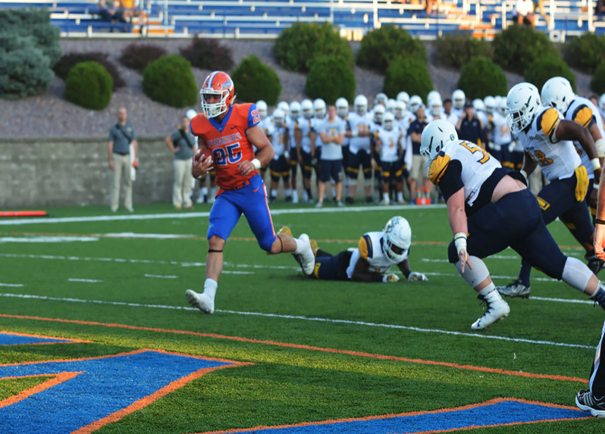 Junior running back Sean Studer rushes for a touch down against the Lakeland Univeristy Muskie defense.