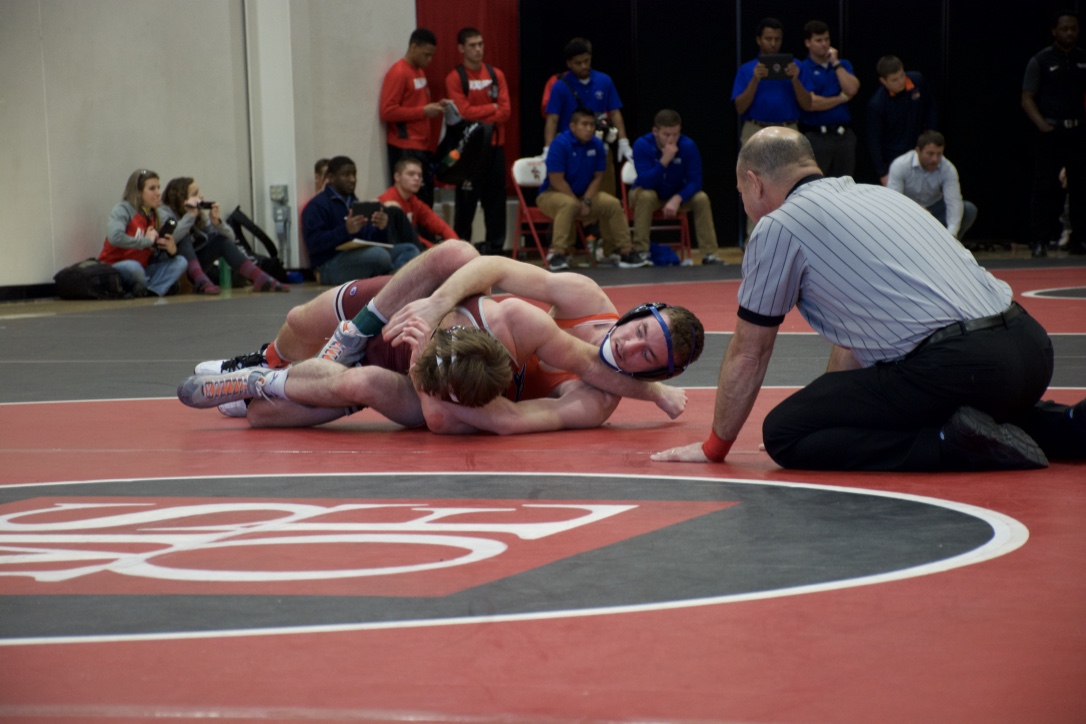 Junior physical education major Scott Arneson helped lead the Pioneers through his 18-1 technical fall victory in the second round at MSOE.