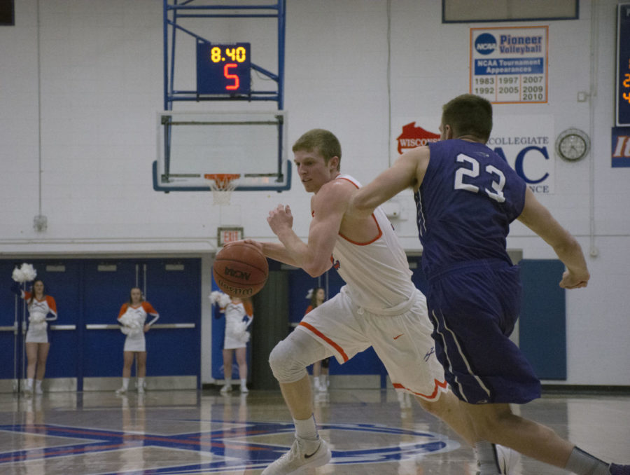 UW-Platteville  junior Robert Duax catches UW-River Falls off guard on defense as he drives to the hoop to score before a shot clock violation.

