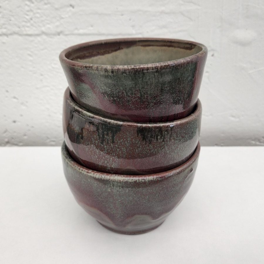 “Medium: Glazed Stoneware
Year: 2022
Three stoneware bowls thrown on the pottery wheel. After being removed from the wheel they were fired, glazed, and fired in reduction to obtain the red and green coloration.”