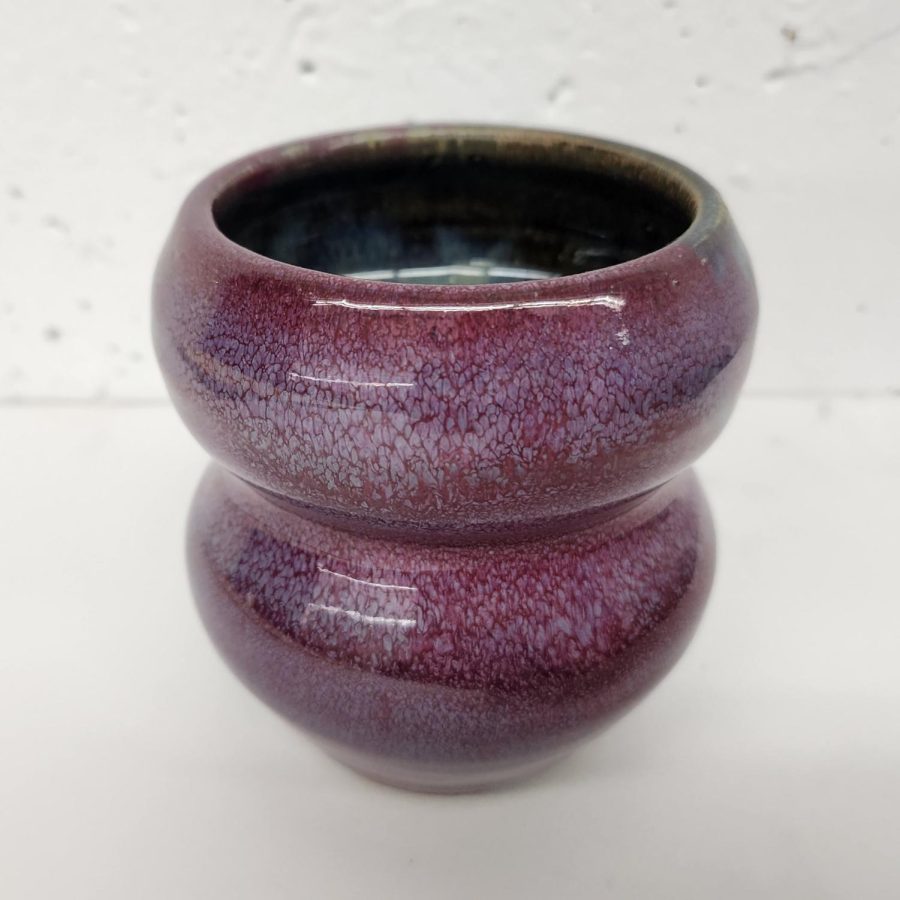 “Medium: Glazed Stonewear
Year: 2022
A red cup with hints of purple that was fired in the reduction kiln.”