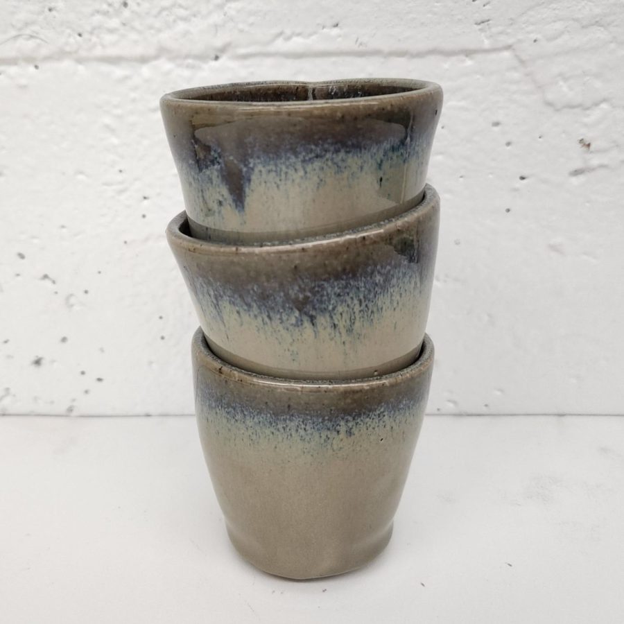 “Medium: Glazed Stonewear
Year: 2021
Three small cups thrown off the hump on the pottery wheel. They were then cut off from the wheel, trimmed, fired and glazed.” 